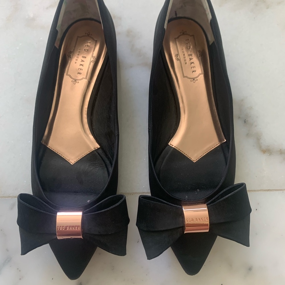 Ted Baker. Bow tie black flats with rose gold accents. Size 39- fits like an 8